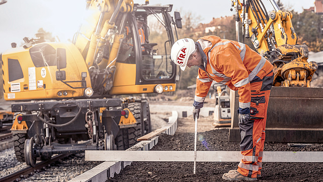 STRABAG Rail Photo of station tracks and construction workers working there